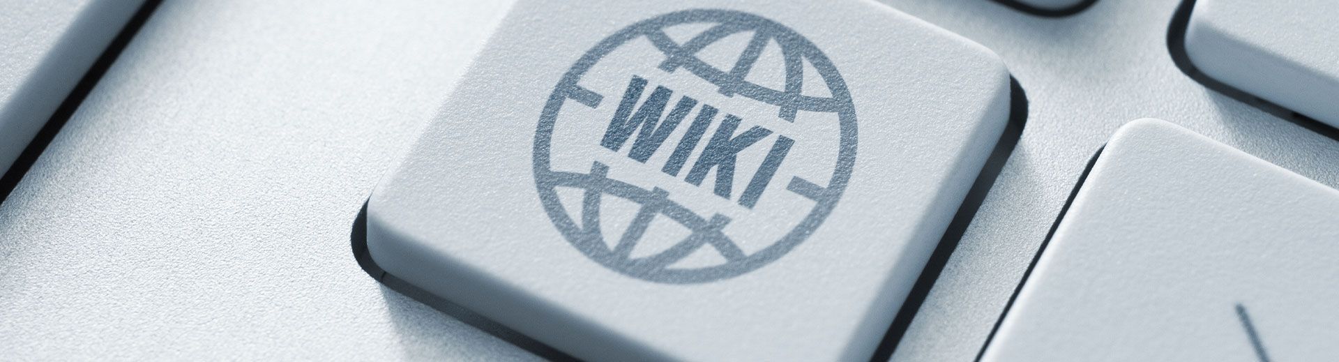 Computertaste auf der Tastatur mit Symbol für das Symbol der Wiki-Enzyklopädie